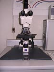 Compound microscope with automatic camera attached